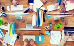 Group of Business People Working on an Office Desk